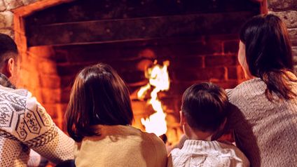 Family by the evening fire